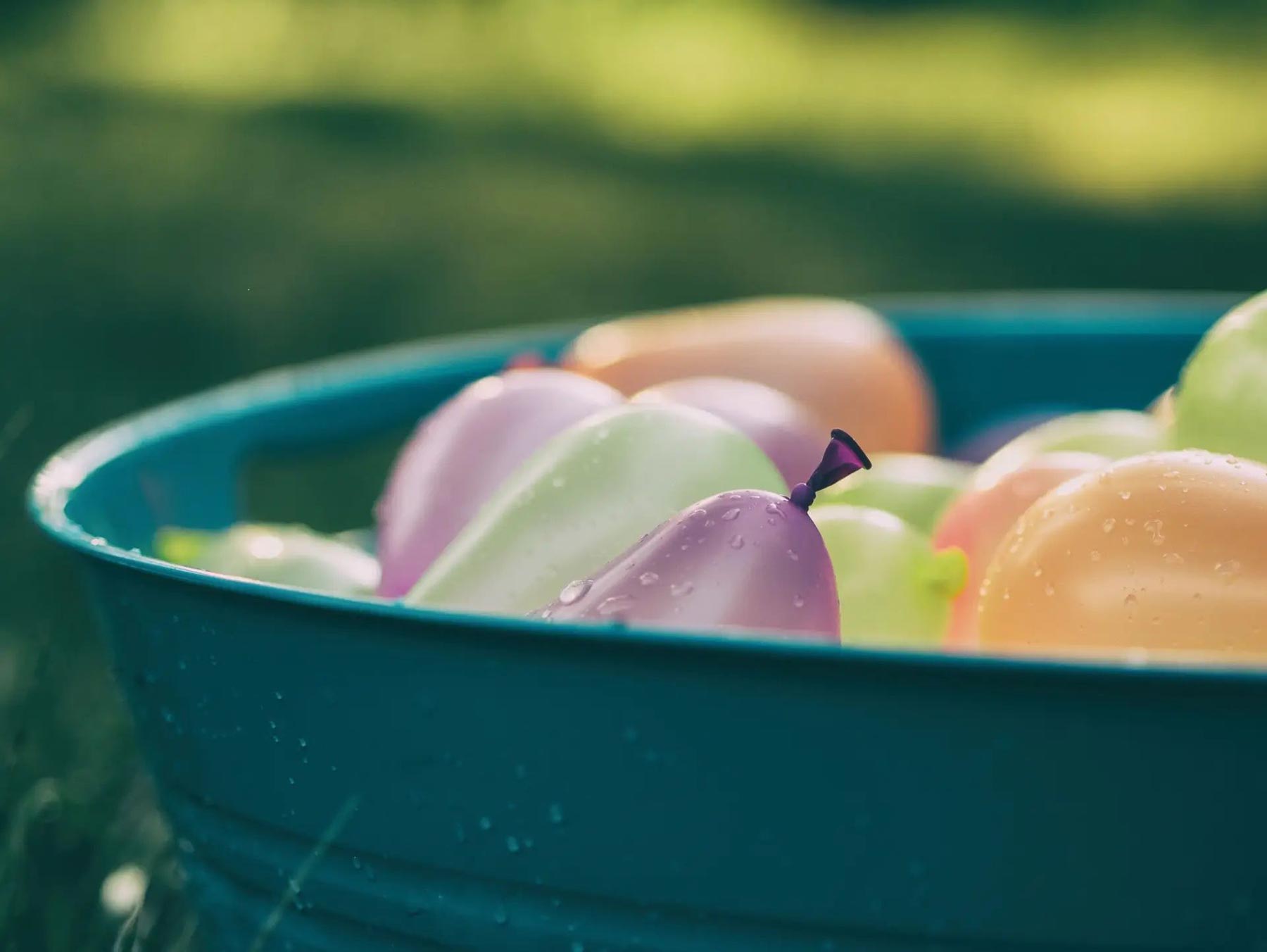 a bucket of water balloons 