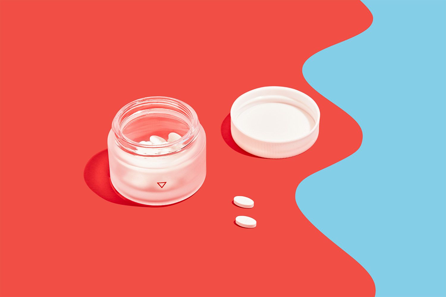 Norethindrone Acetate to delay your period on a red and blue background