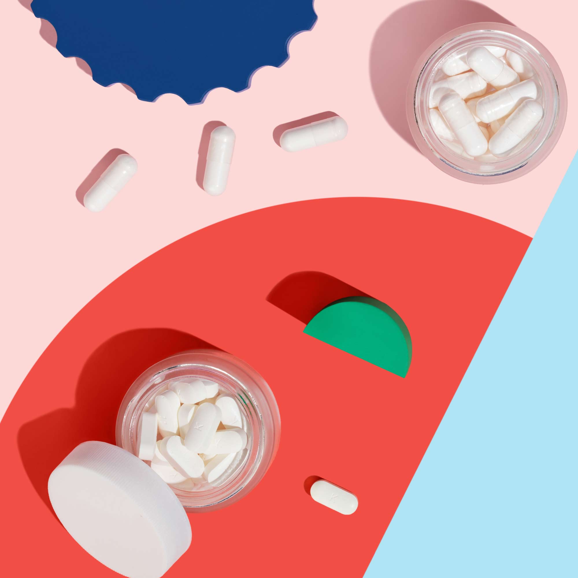 Medication on pink background with colorful geometric shapes