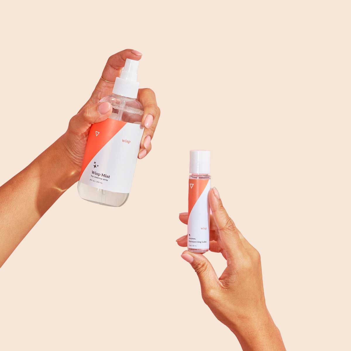 Wisp Toy-Safe Lube and Toy Cleaner with a cream background
