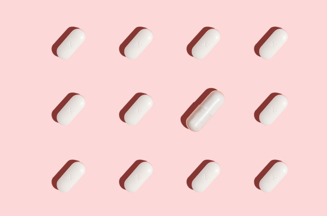 pills from Wisp to treat BV and Yeast Infections on a pink background