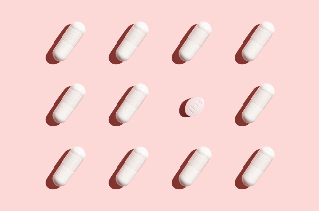 pills from Wisp to treat BV and Yeast Infections on a pink background
