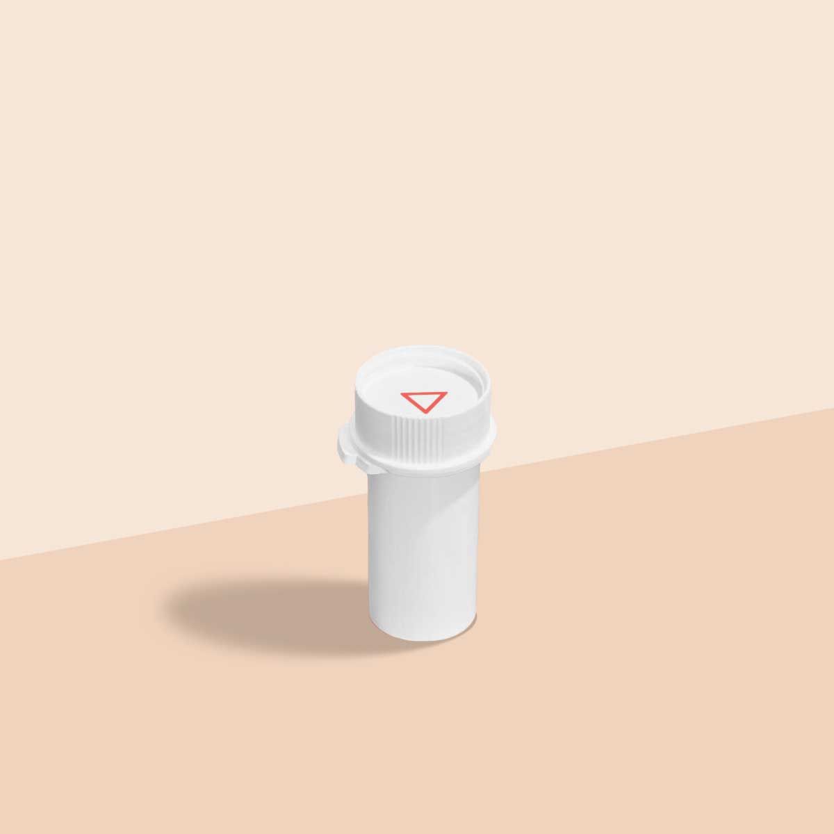 Wisp plastic pill vial on a cream surface