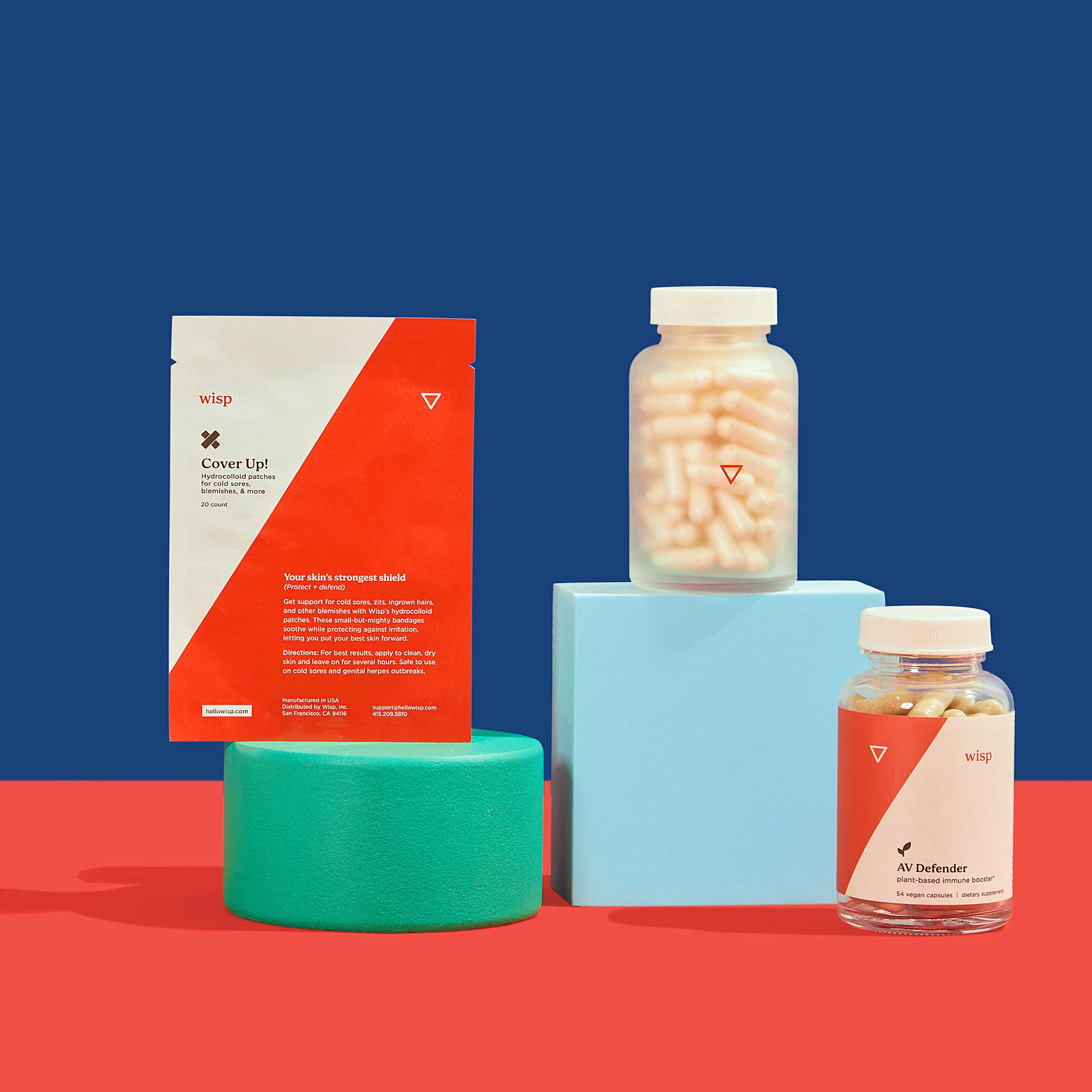Wisp Cover Up Hydrocolloid Patches, AV Defender, and Lysine balanced on colorful abstract shapes on a red surface with a blue background