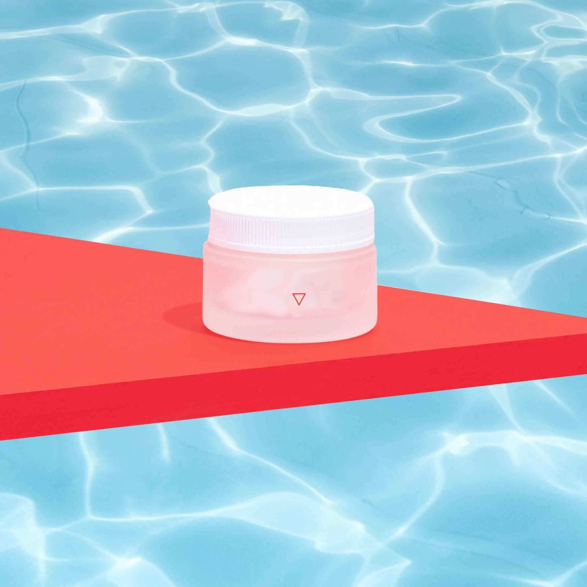 Small jar on top of red ledge with water background