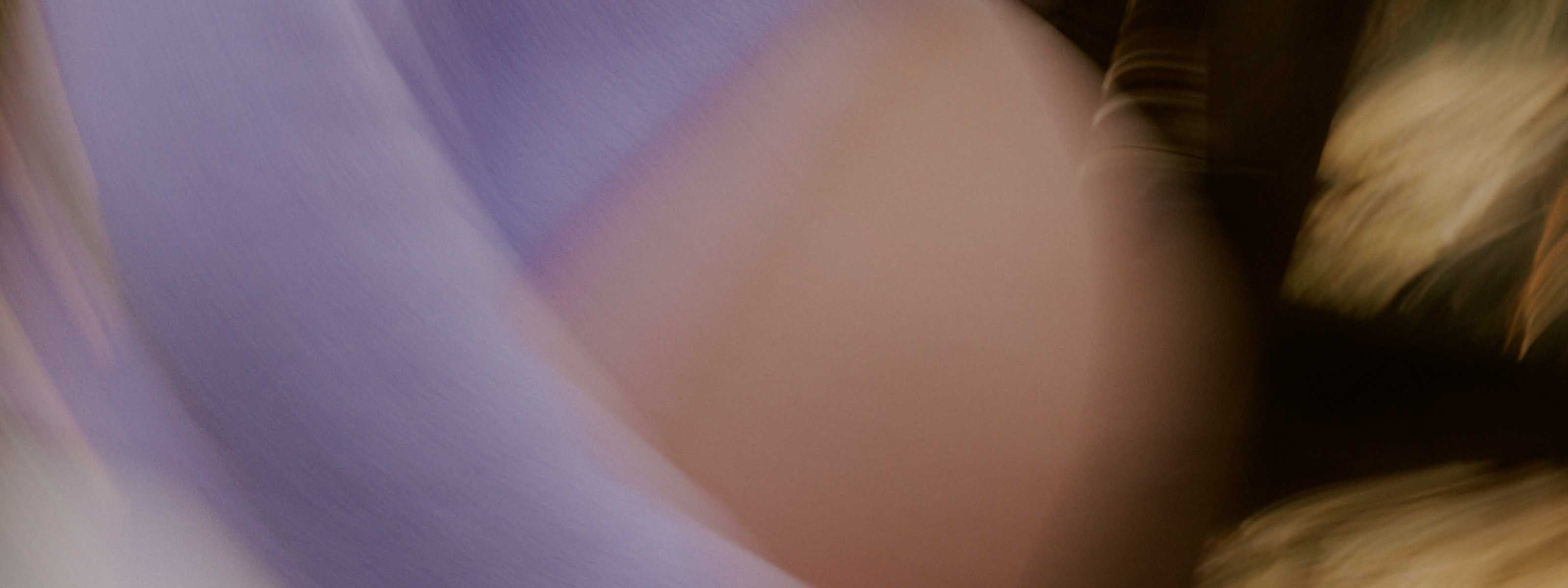 Soft blurred close up of a pregnant torso in motion