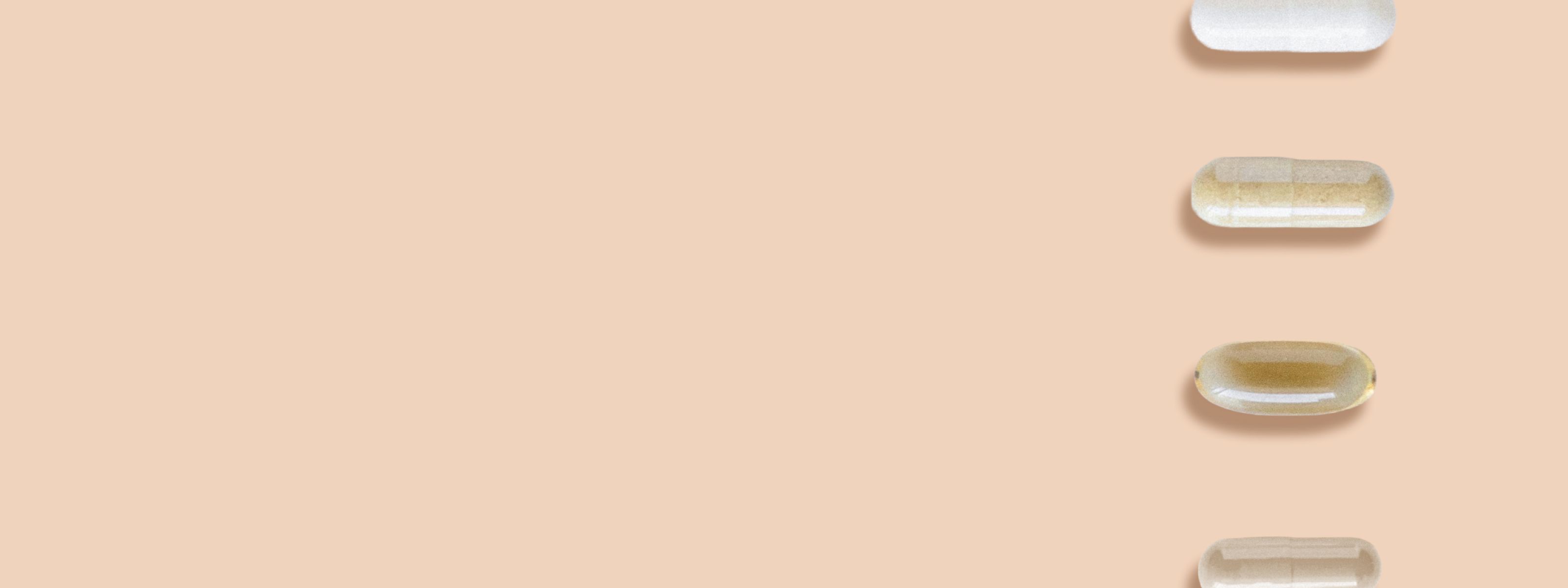 four various pill options laid out against orange background