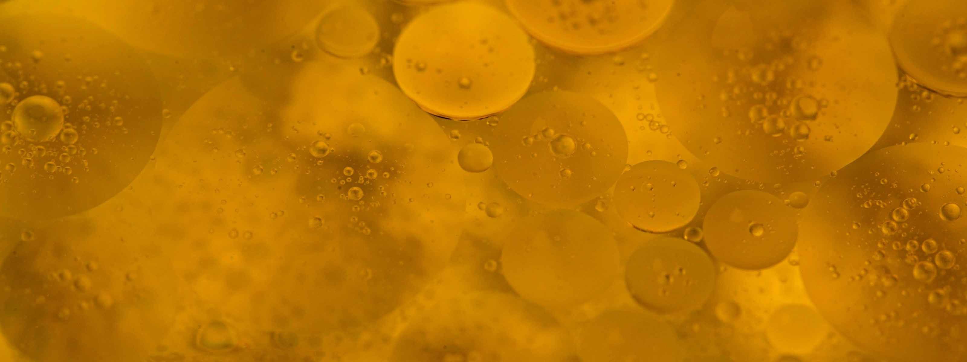 Abstract yellow cloudy liquid