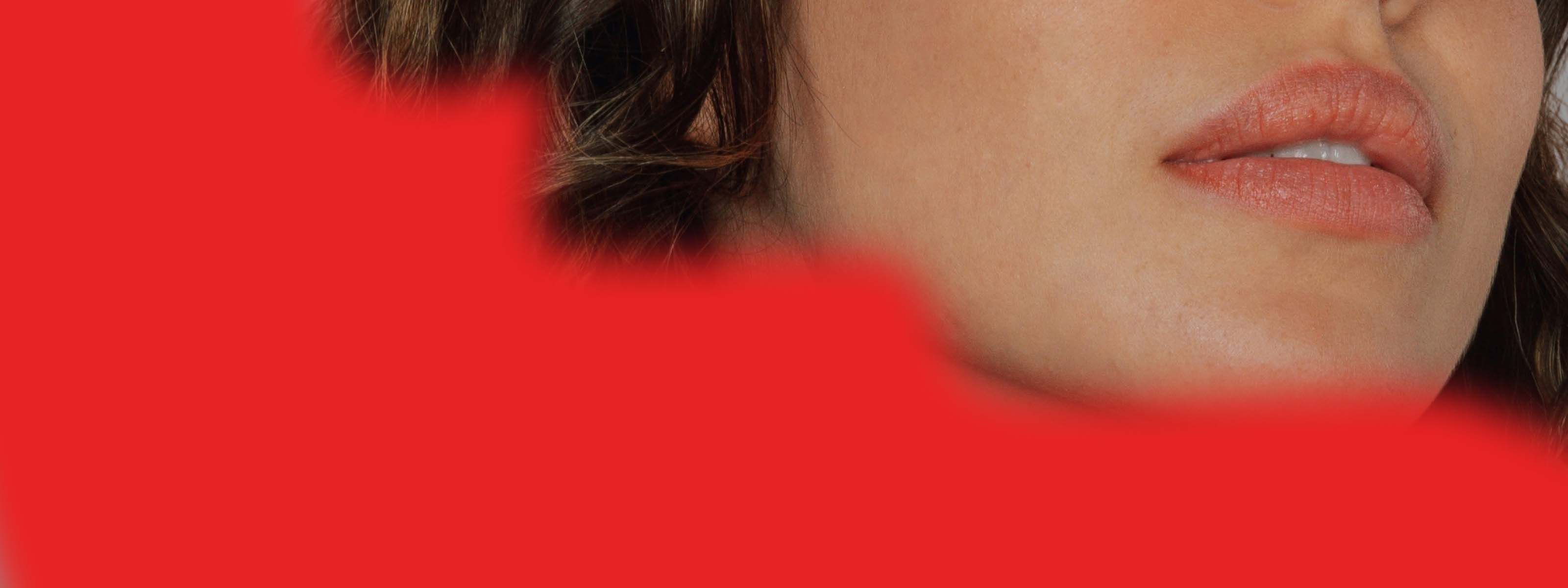 A close up of a woman's face with an organic shaped red overlay