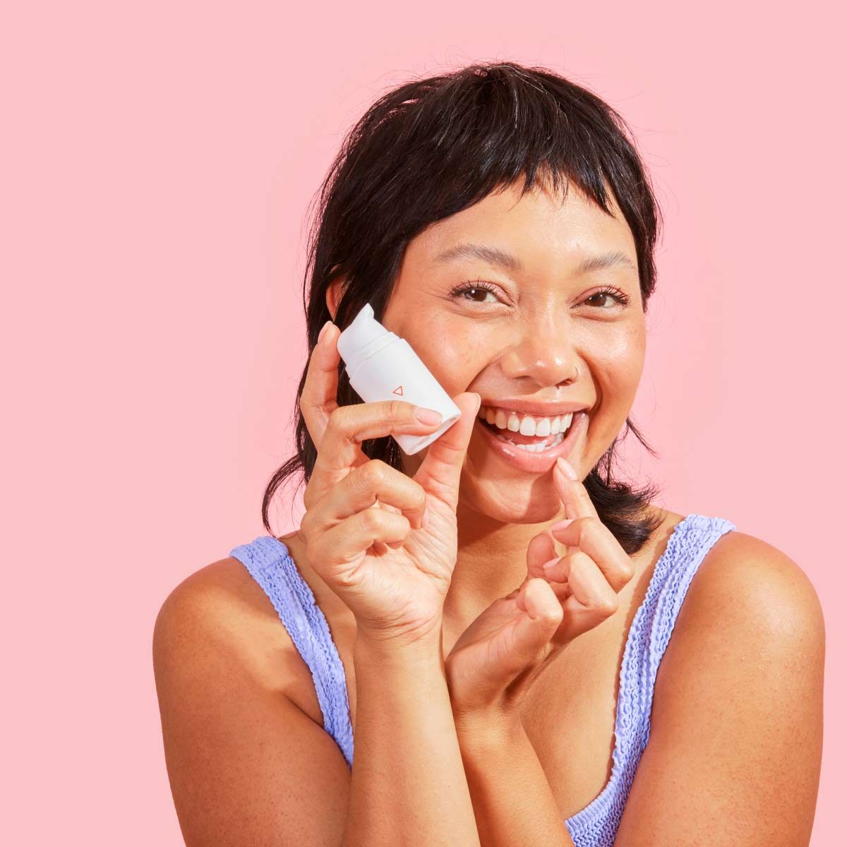 A beautiful woman treats a cold sore with Wisp prescription herpes medication