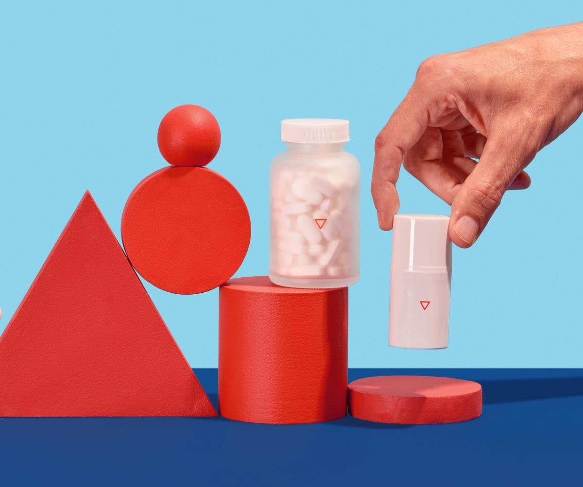 a man's hand reaches for Wisp prescription Genital Herpes treatment and prevention on a blue and red geometric background