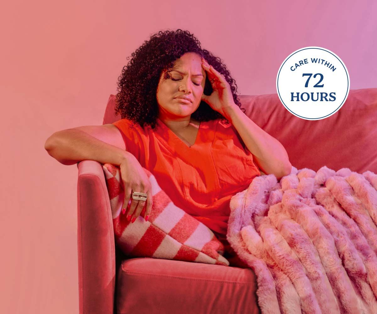 a woman with a migraine laying on a couch on a gradient background