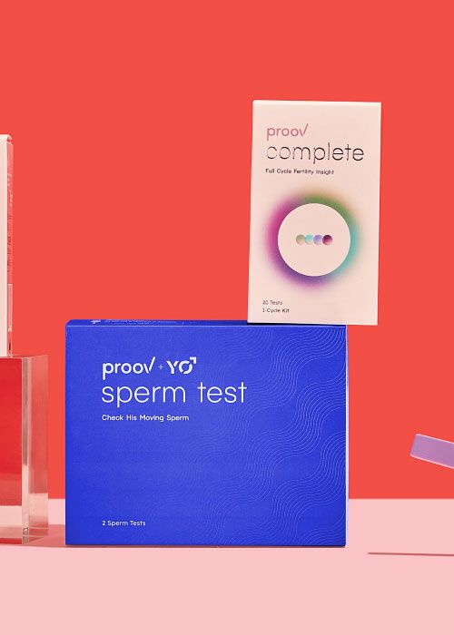 Proov Hers & His Complete Testing System boxes on a pink surface with a red background