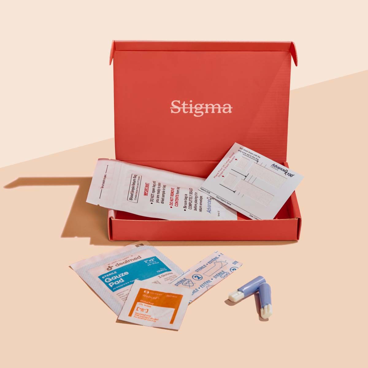 A Wisp diagnostics box with sample collection supplies on a cream surface
