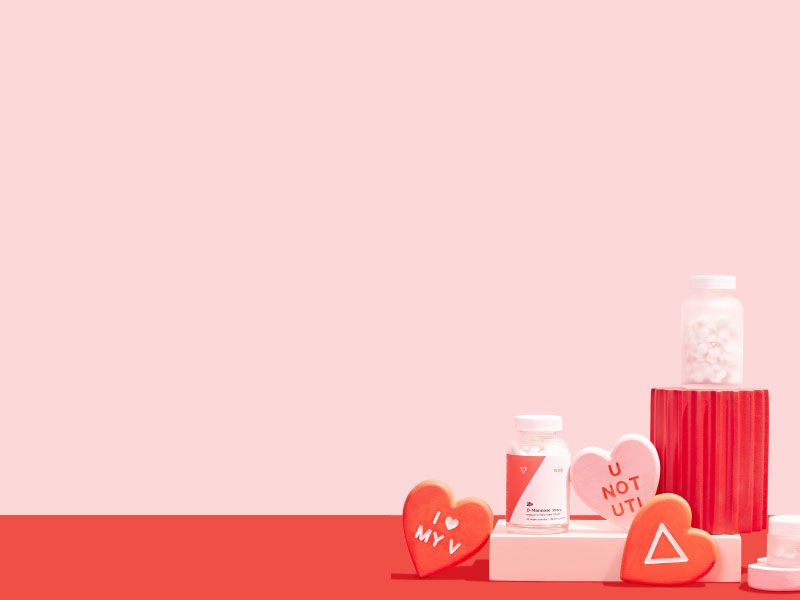 Woman's hand reaching for Wisp glass pill jars with colorful abstract shapes and red hearts on a pink and red backgroundX