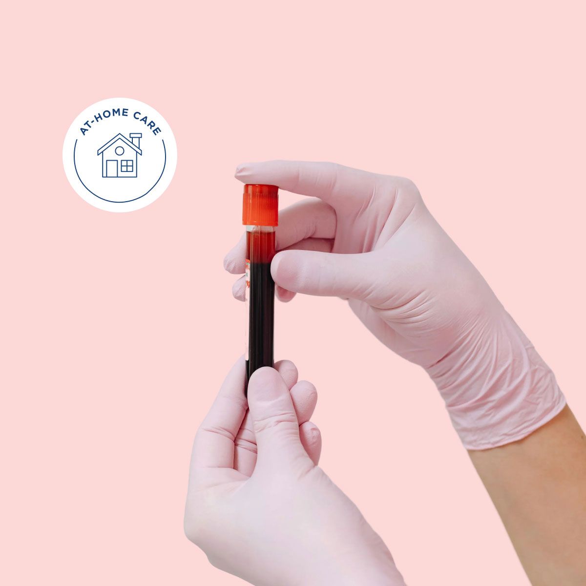 Gloved hands holding a vial of blood in front of a pink background