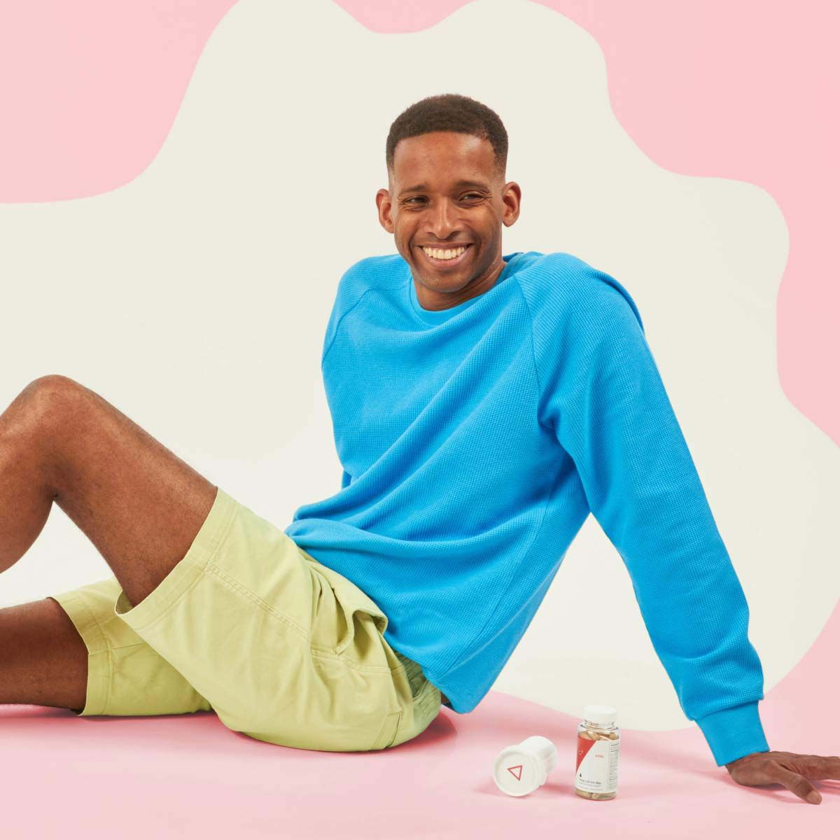 A smiling man with DoxPEP and libido supplements from Wisp