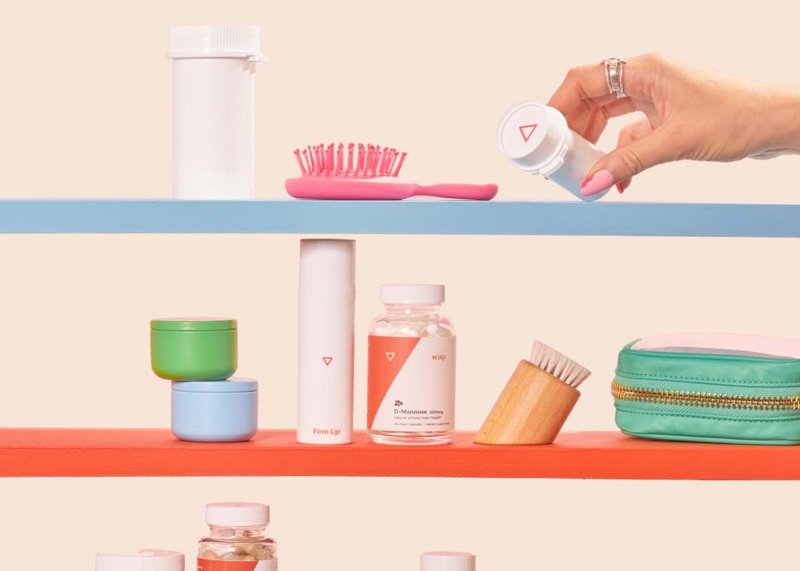 Various Wisp products on colorful shelves in front of a cream background