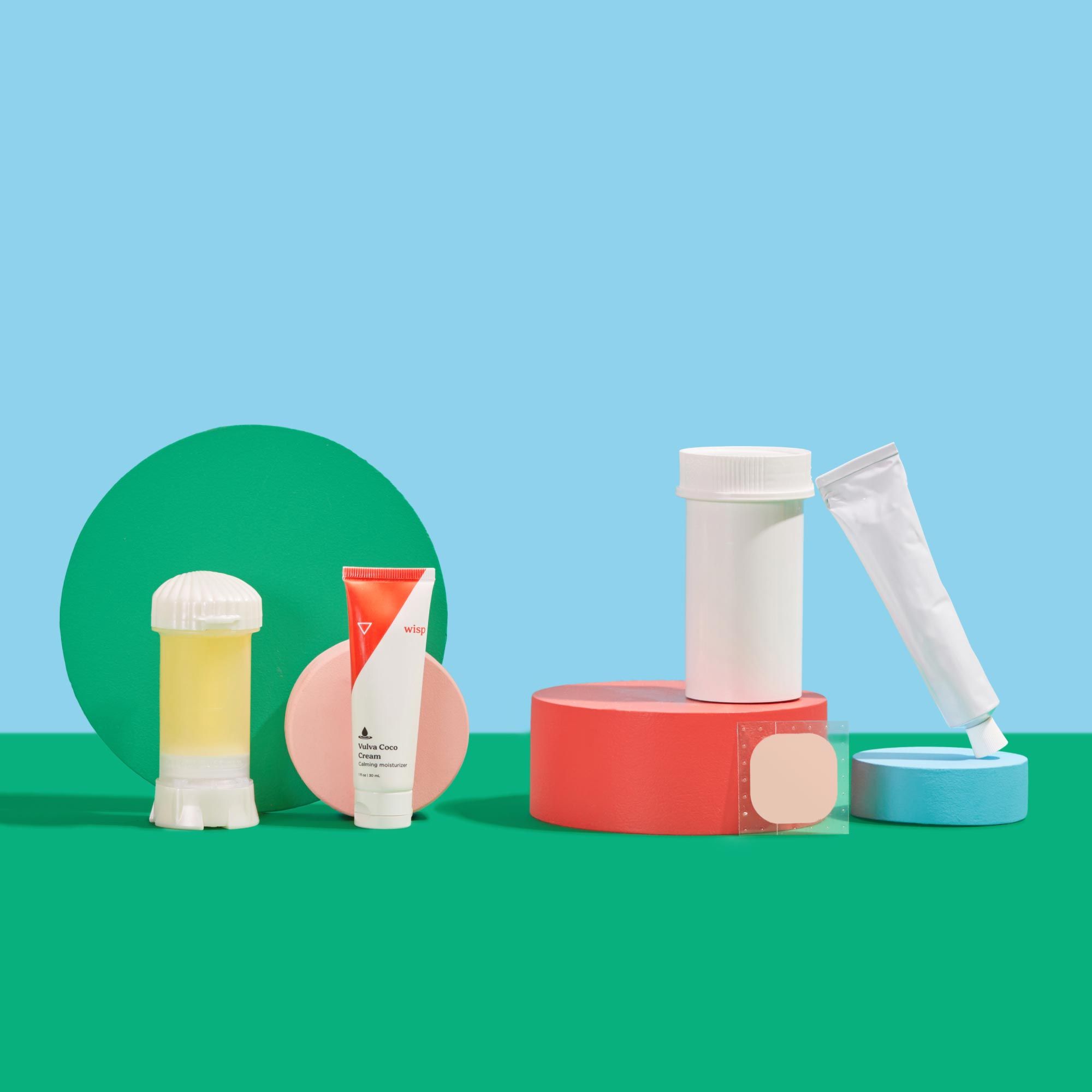 Various Wisp Menopause products with colorful abstract products on a green surface with a light blue background