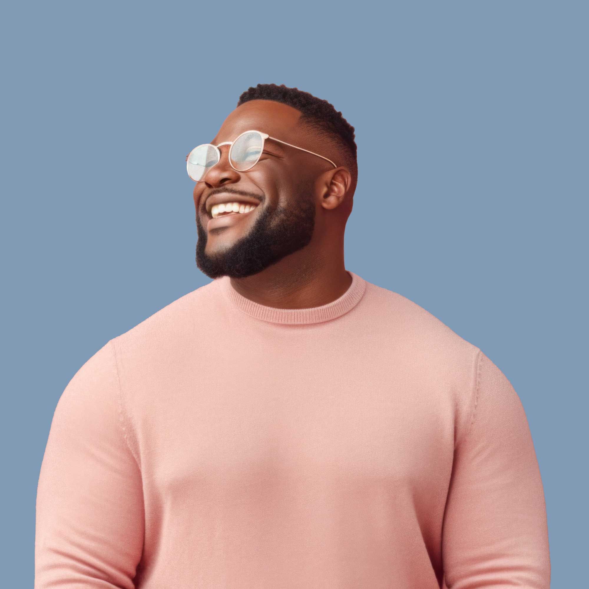 A smiling man wearing a peach-colored sweater in front of a blue background