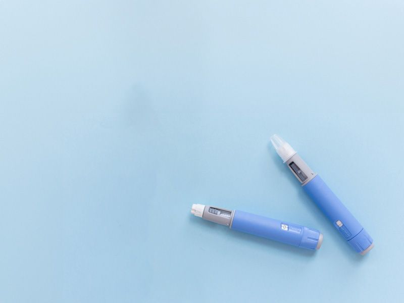 Two Semaglutide pens on a light blue background