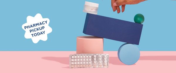 A Wisp glass pill jar and 4 birth control packets are balanced on colorful abstract shapes on a pink surface with a blue background