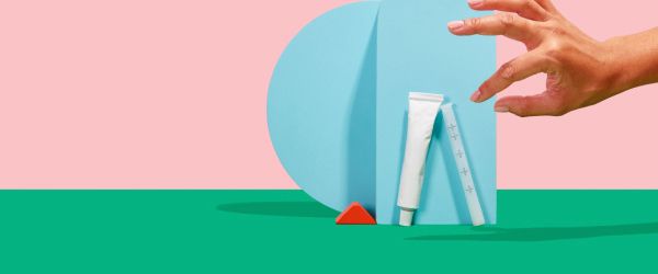 a woman's hand reaches for Wisp vaginal dryness treatment on a colorful geometric background