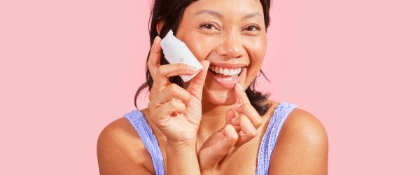 A beautiful woman treats a cold sore with Wisp prescription herpes medication