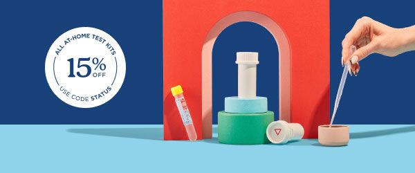 Wisp pill vials and test tubes are balanced on colorful abstract shapes on a blue surface