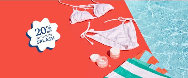 A white bikini, striped towels, and Wisp medications sitting on a red surface next to a pool