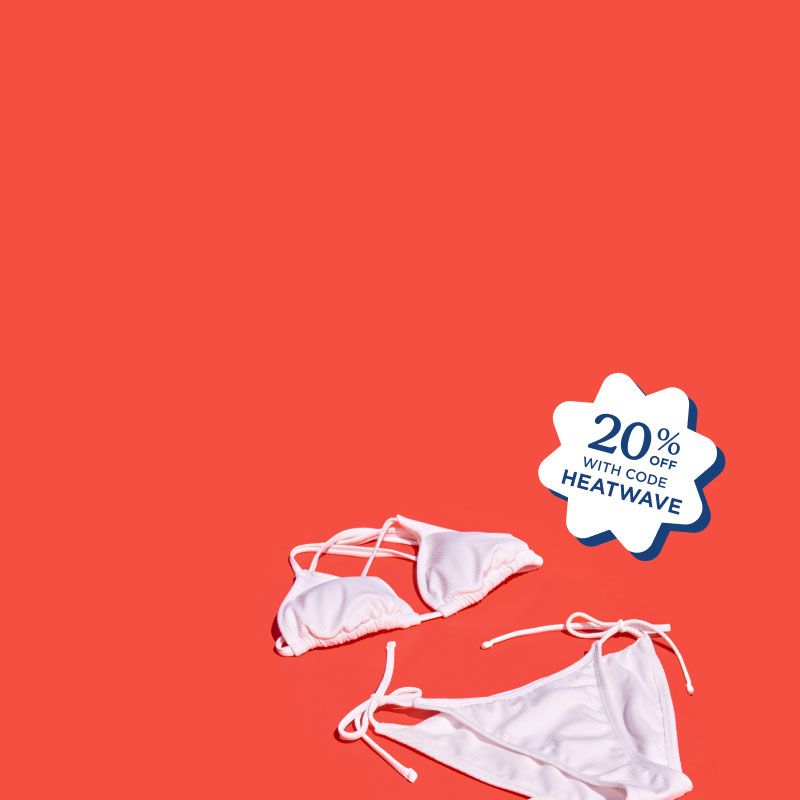 A white bikini and Wisp medications on a red surface