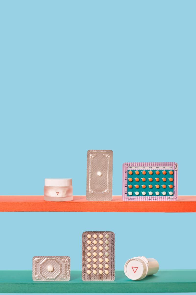 Wisp birth control, emergency contraception and pill bottles and vials on colorful shelves with a light blue background