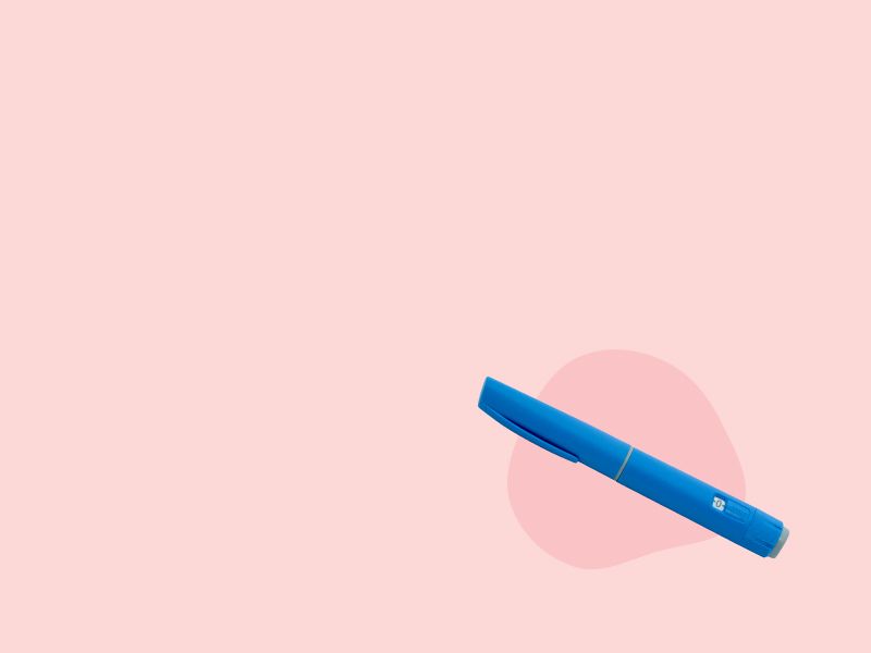 An Ozempic injectable on a pink background