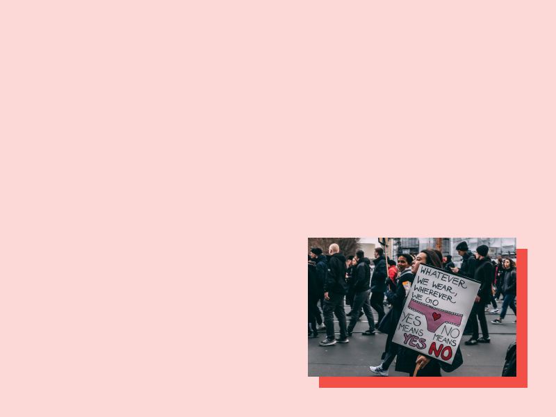 Protesters and a sign supporting women's rights and sex positivity