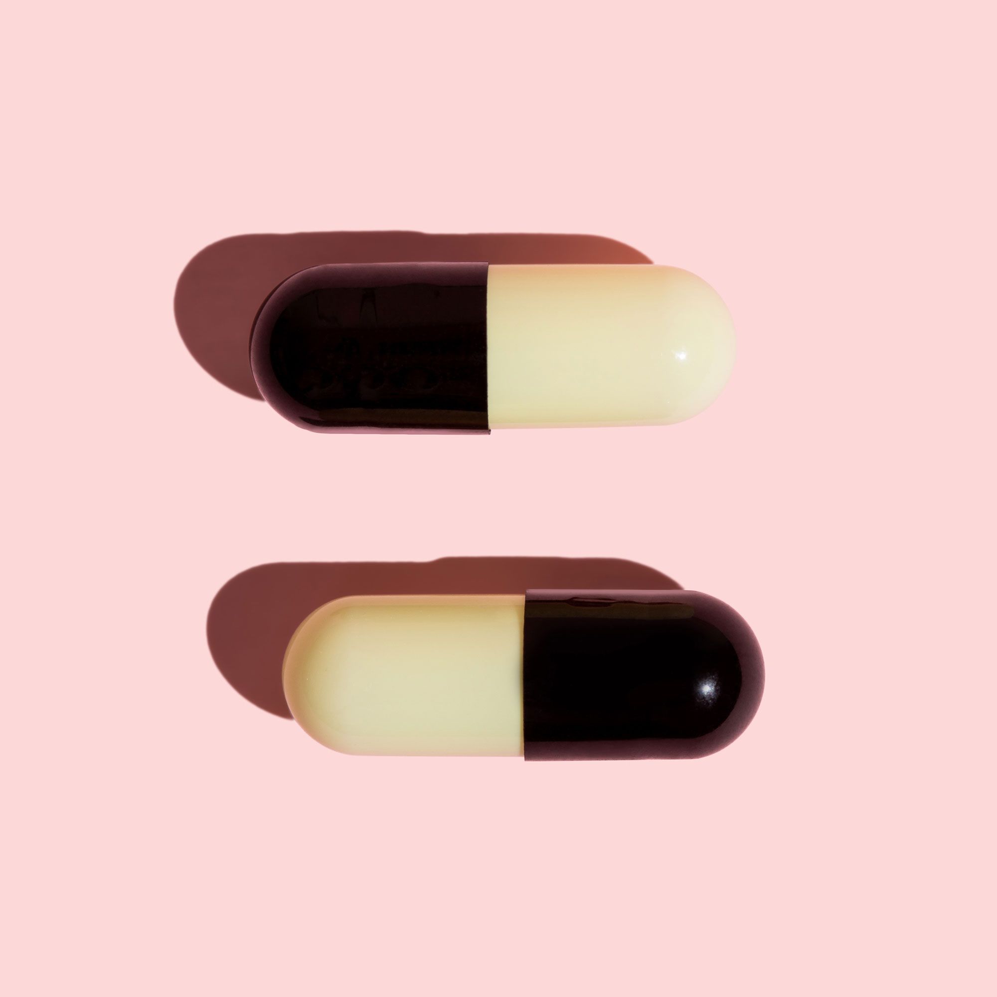 UTI antibiotics on a pink surface