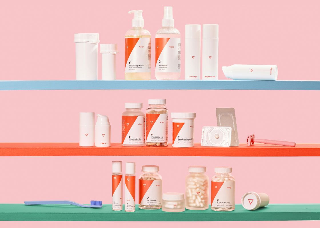 Various Wisp products on colorful shelves in front of a pink background