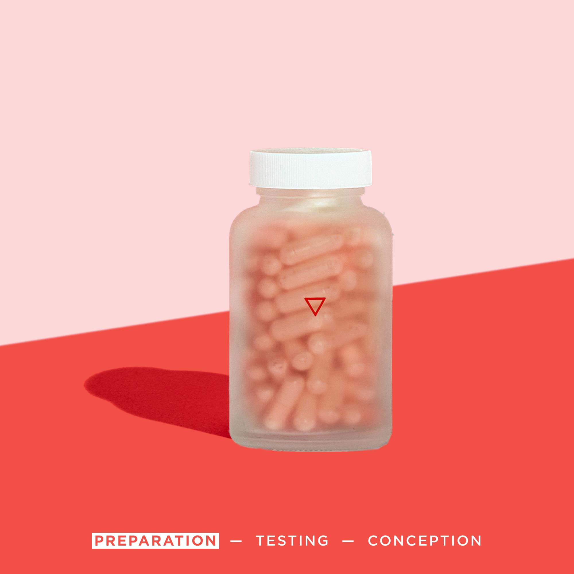 Wisp prenatal vitamins on a red surface with a pink background