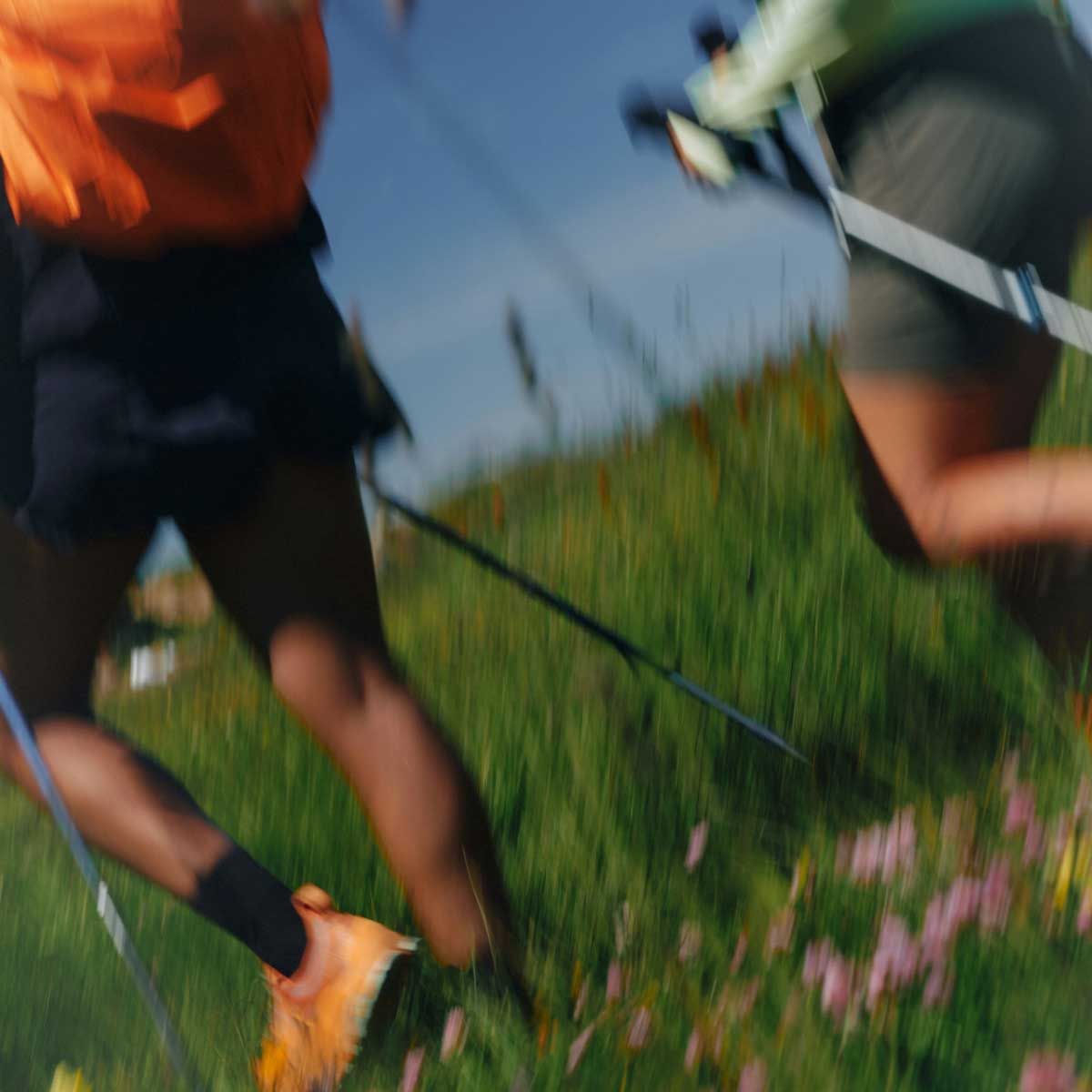 Two people jogging outdoors with motion blur