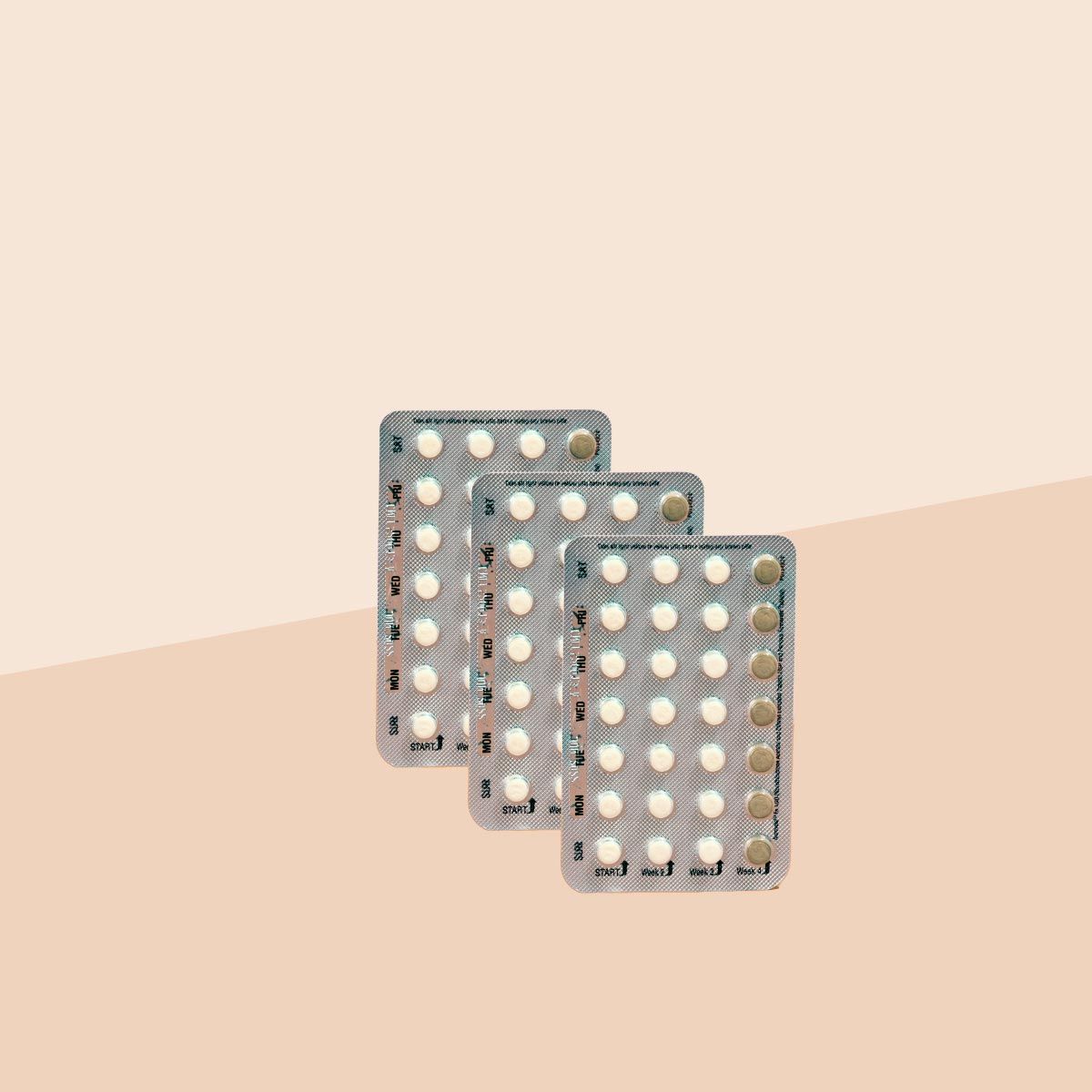 3 packets of Slynd birth control on a cream surface