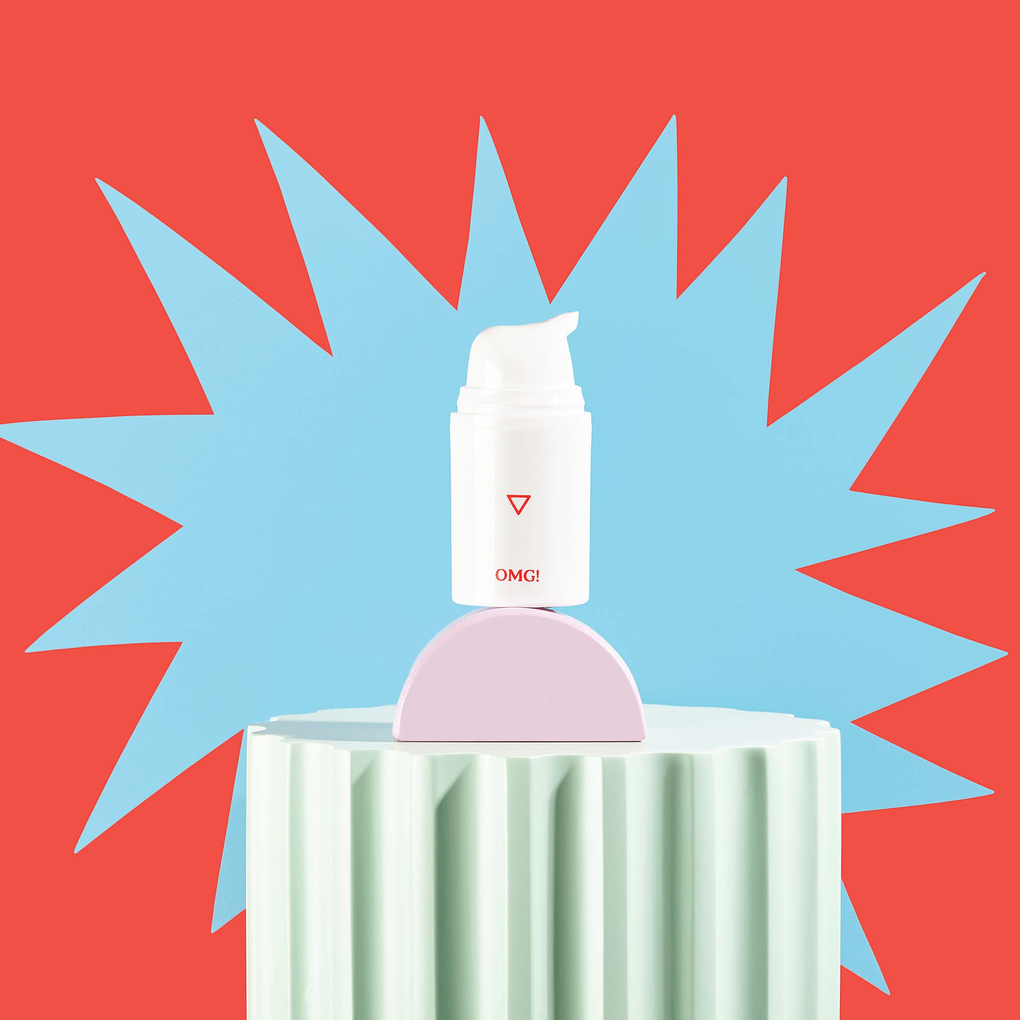 Bottle of OMG! Cream on red background with colorful geometric shapes