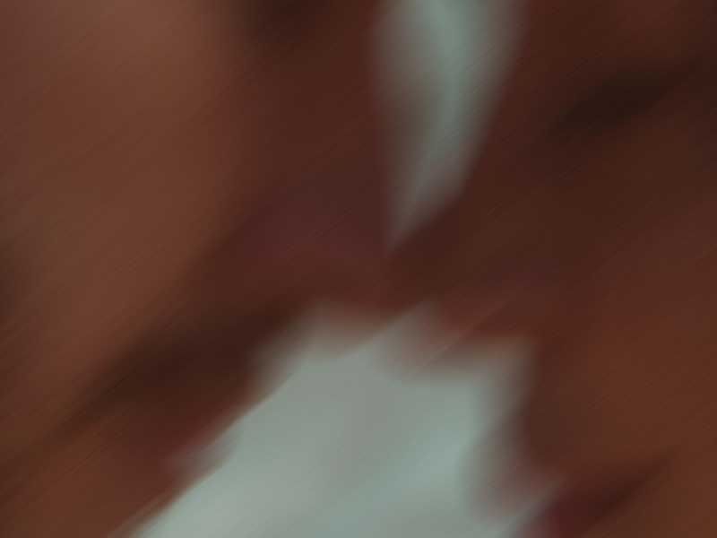Profile of blurred couple with their heads close together