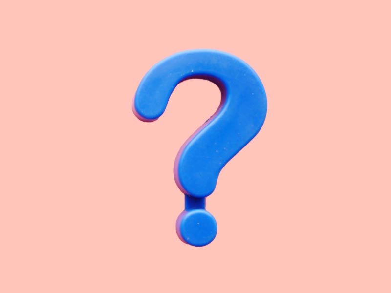 A purple question mark on a peach-colored background