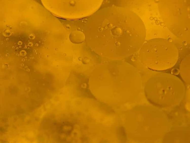 Abstract yellow cloudy liquid