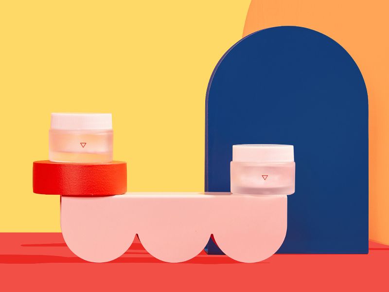 Wisp glass jars with Gonorrhea meds on a colorful geometric background