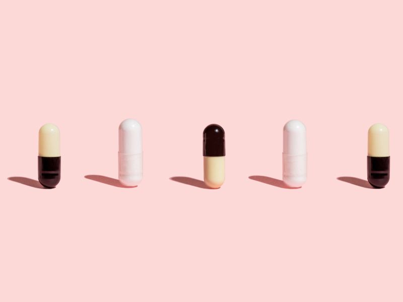 UTI pills on a pink background