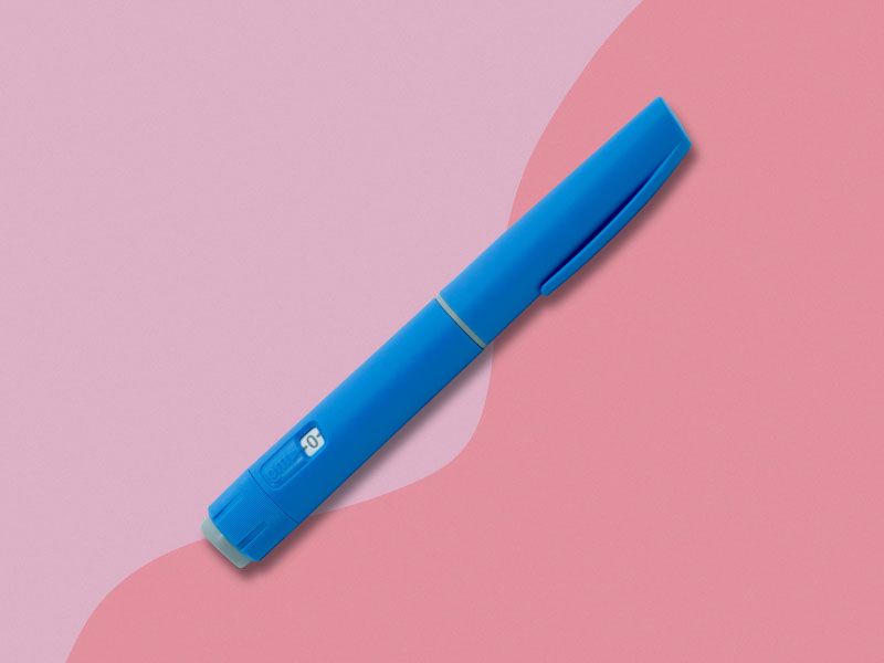 A Semaglutide pen on a two-toned pink background