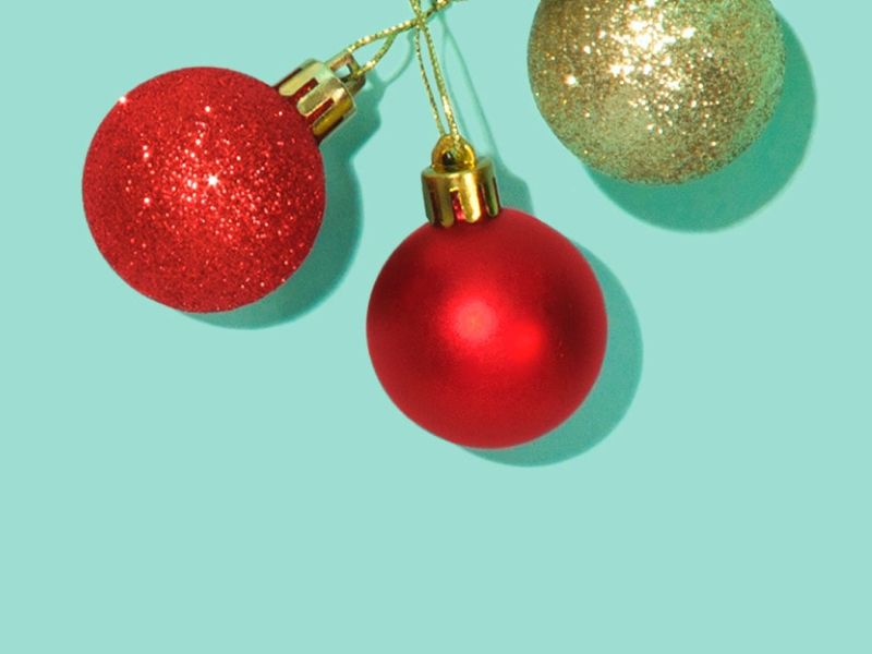 Christmas decorations, garland and ribbon on a green surface