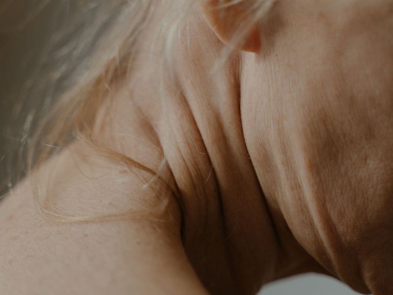 image of a womans neck with a strand of hair