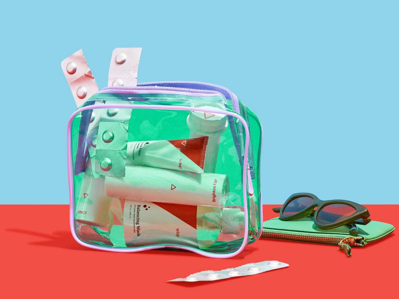 Wisp medications in a green travel bag on a red and blue background