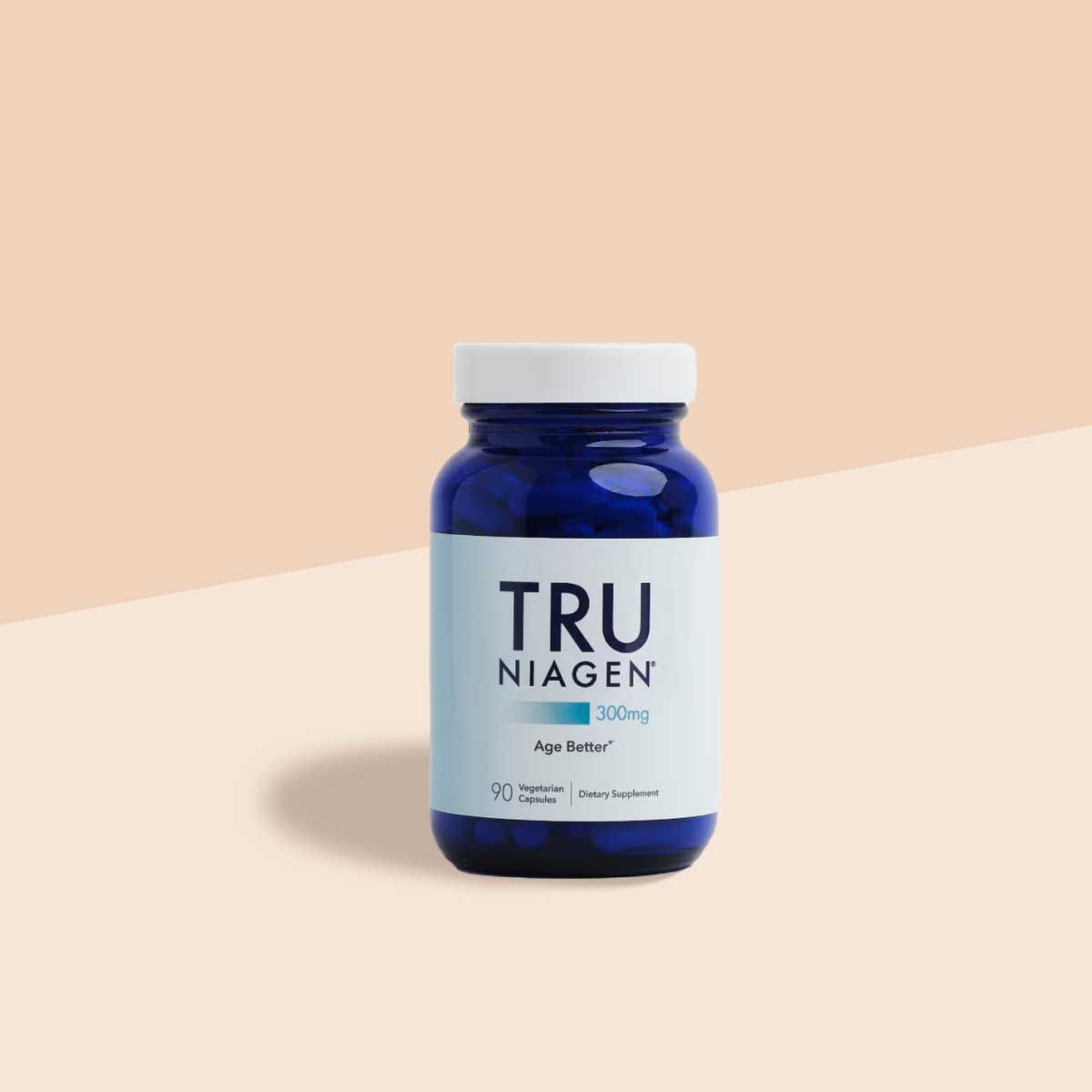 A Tru Niagen supplement bottle on a cream surface